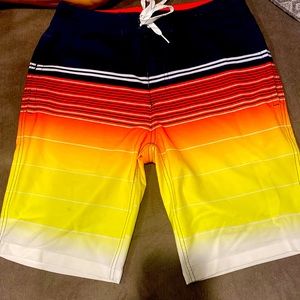Trinity Boardshorts bathing suit. Size 30. Colors- Navy blue, white, red, etc.